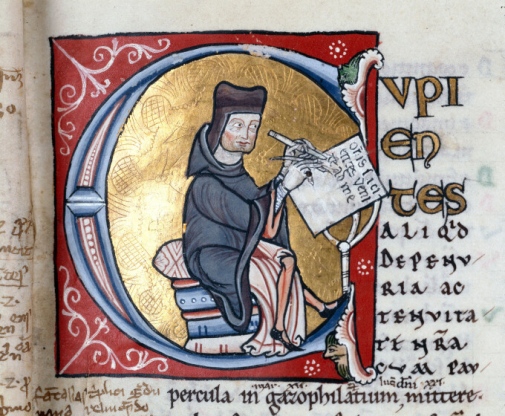 Medieval scholar writing a manuscript.